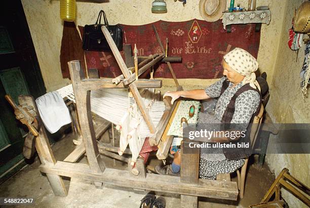 Romania: Local people in the village of Logic. A loom.