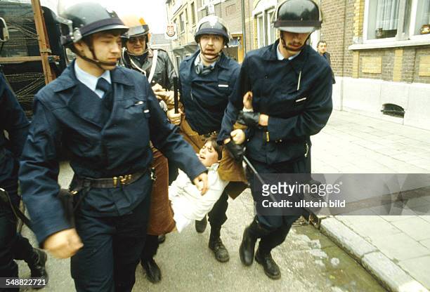Belgium: A female Walloon is being arrested by the police.