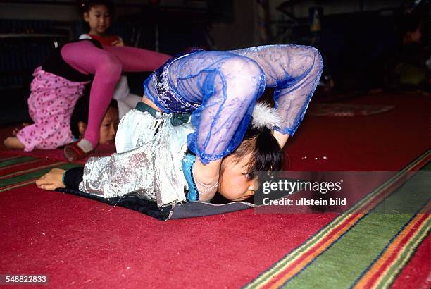 Mongolia, the famous snake girls of the Mongolian state circus training in Ulaanbaatar.