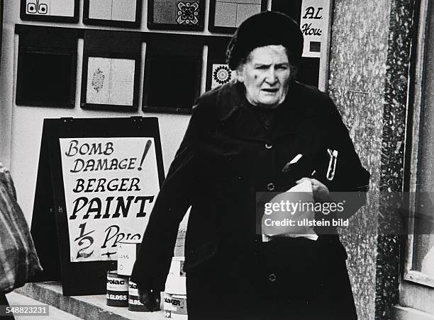 Northern Ireland, Londonderry: A bomb damage sale on Strand Road in the downtown shopping area