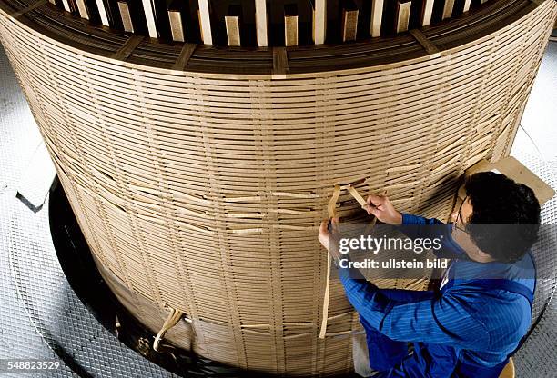 Germany, Mannheim: ABB. Transformer production. Transformer high tension development . Spool connections are isolated. -