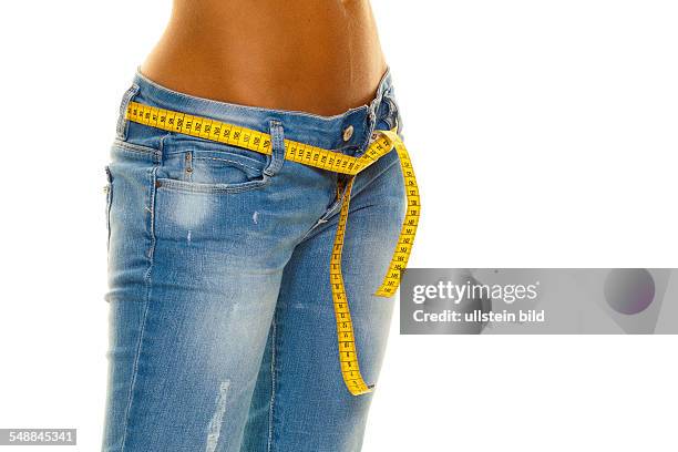 Symbolic photo diet, woman wearing jeans with measuring tape