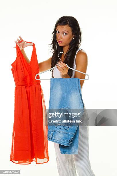 Young woman is reflecting how to dress