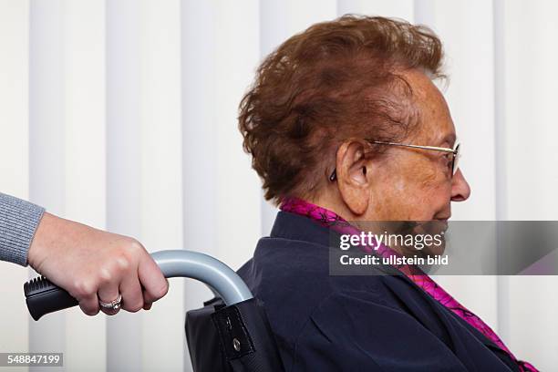 Elder lady in a wheel chair -