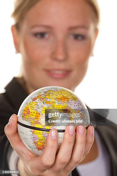 Woman holding a globe in her hand -