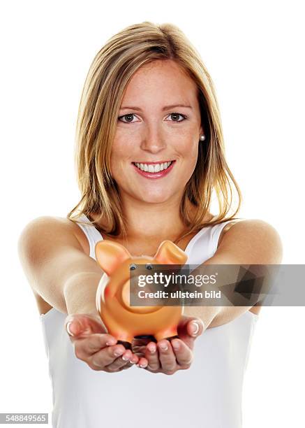 Symbolic photo saving money, woman presenting a piggy bank -