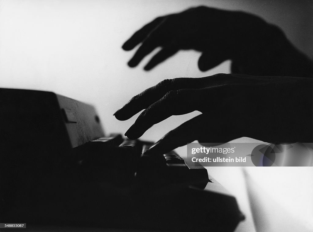 Germany - hands writing with a typewriter