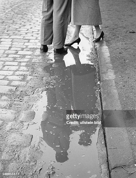 Germany Bavaria - couple is reflecting in a puddle - 1950s