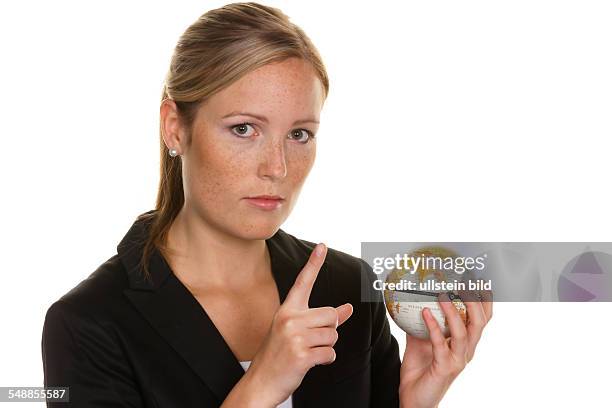 Woman holding a globe in her hand -