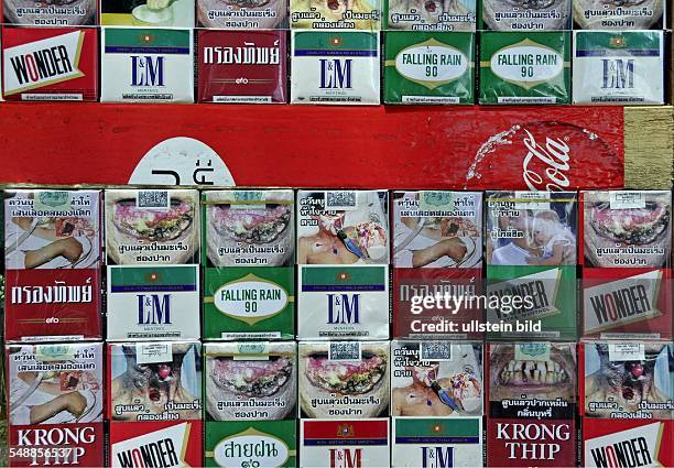 Thailand Bangkok Bangkok - Thai cigarette packs with health warning and deterrent photos