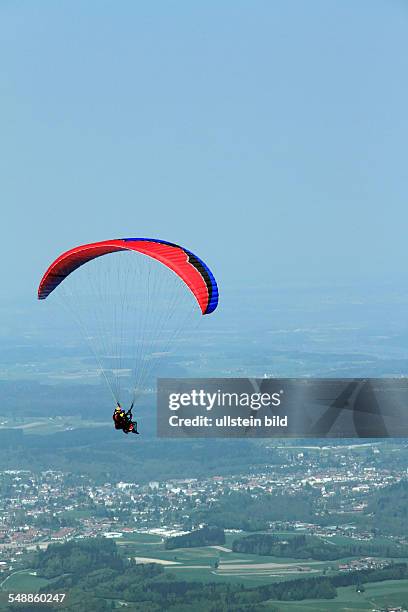 Germany Bavaria Chiemgau - paraglider at mountain Hochfelln