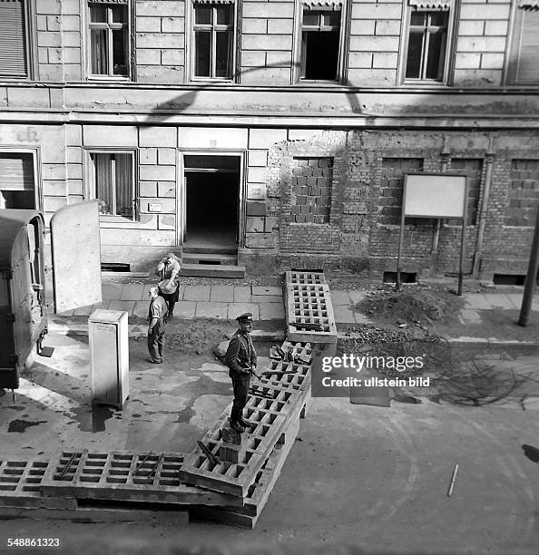 German Democratic Republic Bezirk Berlin East Berlin - Eviction of houses at Sebastianstrasse and Luckauer Strasse near to the border in Kreuzberg /...