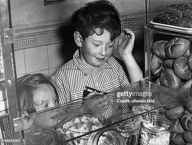 Germany Bavaria - children at the baker's, looking at sweets - 1950s