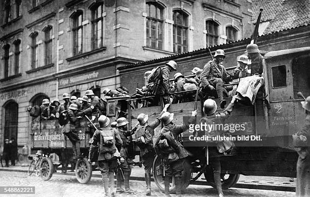 Nazi Sturmabteilung members from the countryside arriving outside the Bürgerbräukeller, scene of the Beer Hall Putsch, the Nazi Party's failed coup...
