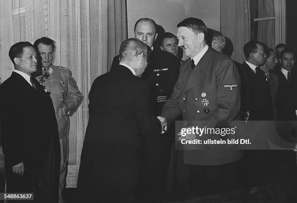 Reception for Matsuoka in the 'Fuehrer's apartment' in the Reich Chancellory in Berlin: Adolf Hitler thanking the japanese foreign minister for his...