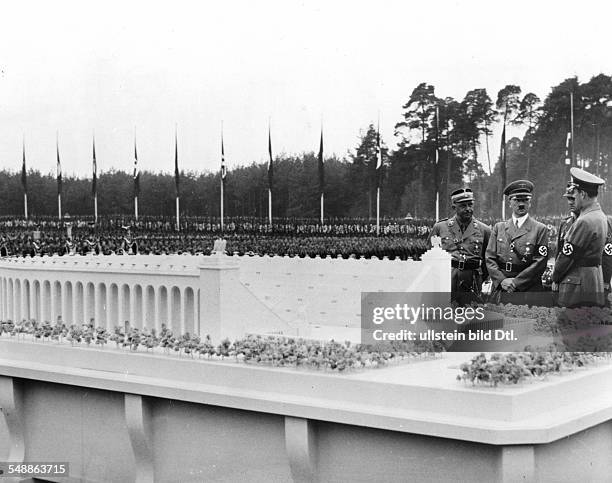 Germany, Third Reich - NSDAP Nuremberg Rally 1937 Adolf Hitler inspecting a model of the planned 'German stadium' before the laying of its foundation...