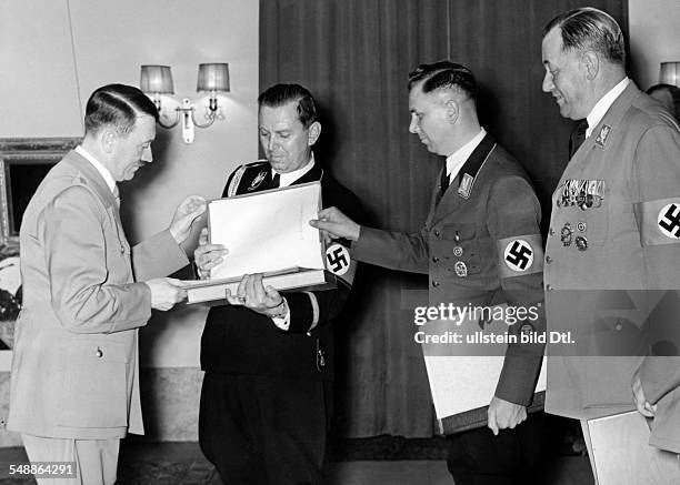 The adjutants congratulating Adolf Hitler, from right: William Brueckner, Albert Bormann, Julius Schaub - - Photographer: Presse-Illustrationen...