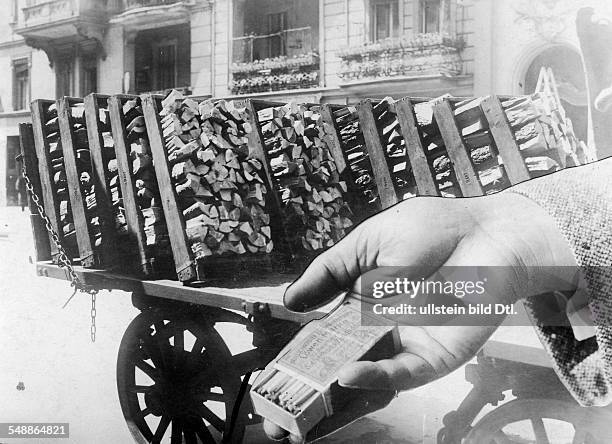 Germany : infaltion, price comparison, a box of matches cost as much as a cartload of wood - 1923 - Photographer: Frankl - Vintage property of...