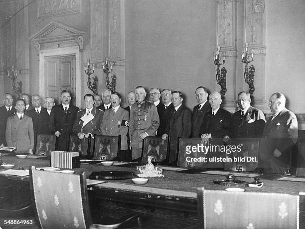 German Reich, Adolf Hitler and the members of the government of the Reich after their meeting in which they decided to reintroduce compulsory...