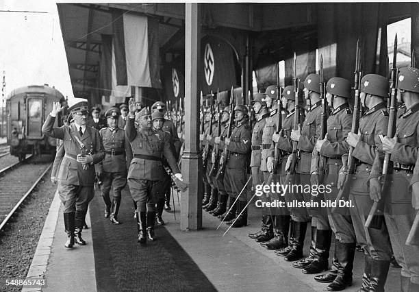 France, Hendaye: Adolf Hitler and Francisco Franco stepping out the Guard of Honour, with in retinue: Field Marshal Walther von Brauchitsch - -...