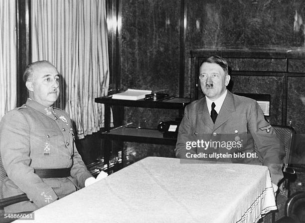 In the saloon car of Hitler on the French frontier station: Hitler in conversation with Francisco Franco y Bahamonde - - Photographer:...