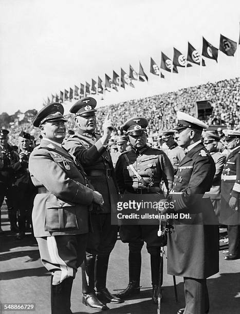 Nuremberg Rally 1935: From the left: Hermann Goering, Reich Minister of Defense General Werner von Blomberg, the commander-in-chief of the Army High...