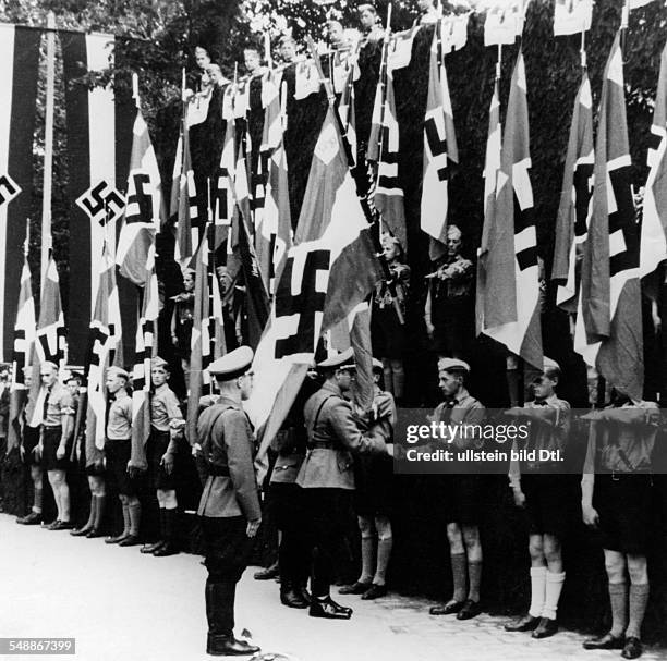 Luxembourg : Reich Youth Leader Artur Axmann admitting the Luxembourg national youth in the Hitler Youth, he inaugurated the Hitler Youth flags with...