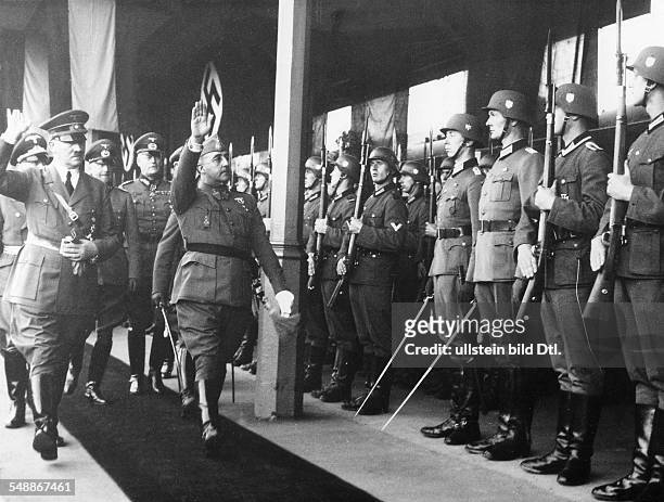 France, Hendaye: Adolf Hitler and Francisco Franco stepping out the Guard of Honour, with in retinue, from left: the Field Marshals Walther von...