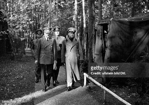 Adolf Hitler and the italian foreign minister Galeazzo Graf Ciano going for a walk near the Fuehrer's headquarters 'Wolfsschanze' near Rastenburg in...