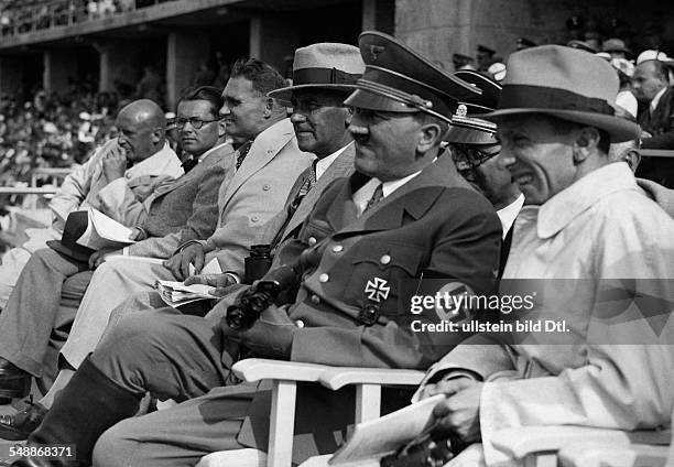 Berlin: 1936 Olympics, Adolf Hitler on the rostrum at the stadium, next to right: Joseph Goebbels, to the left: the Minister of the Interior of the...