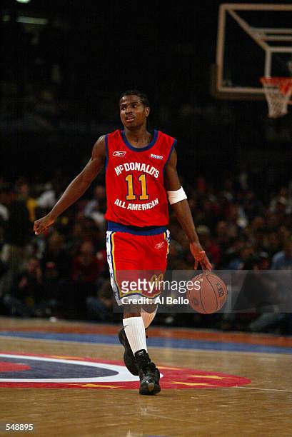Dee Brown of the West team brings the ball down court during the McDonalds boys High School All America Game against the East team at Madison Square...