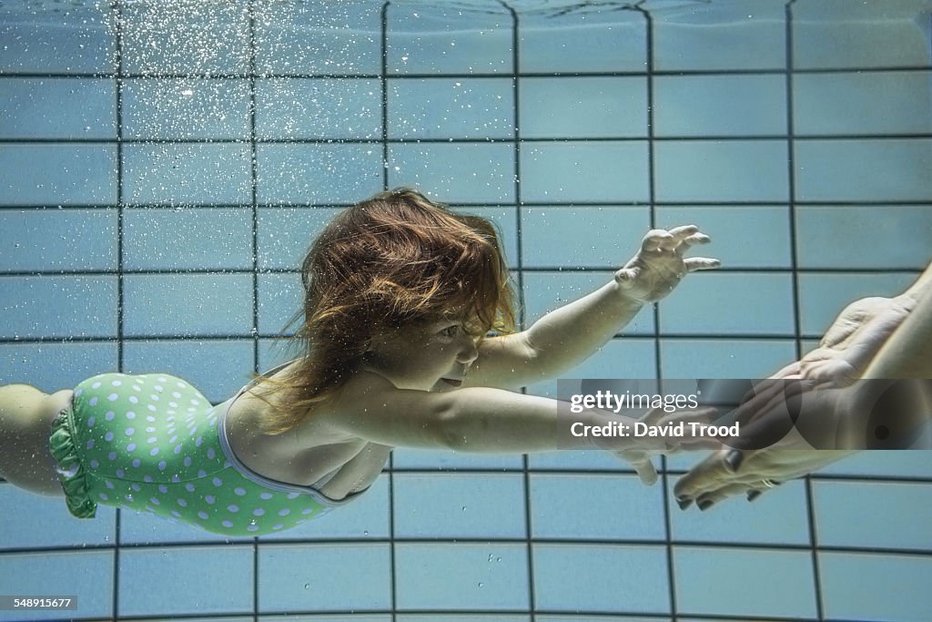 Child learning to swim.