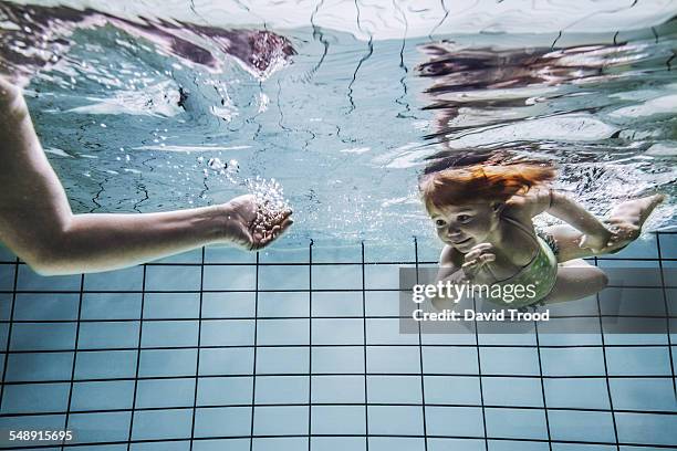 child learning to swim. - child swimming stock pictures, royalty-free photos & images