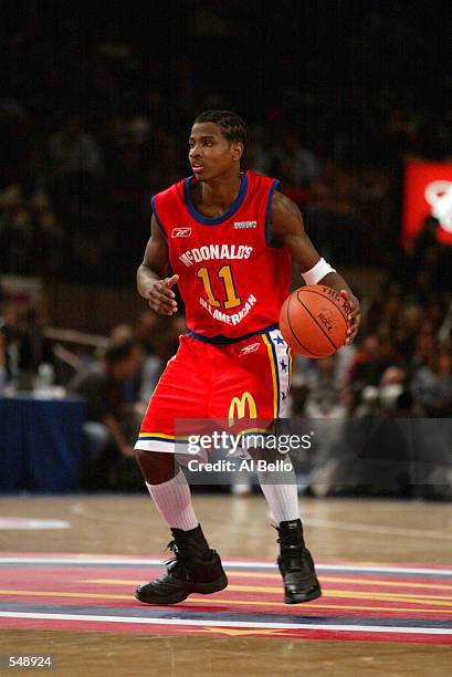 Dee Brown of the West team brings the ball down court during the McDonalds boys High School All America Game against the East team at Madison Square...