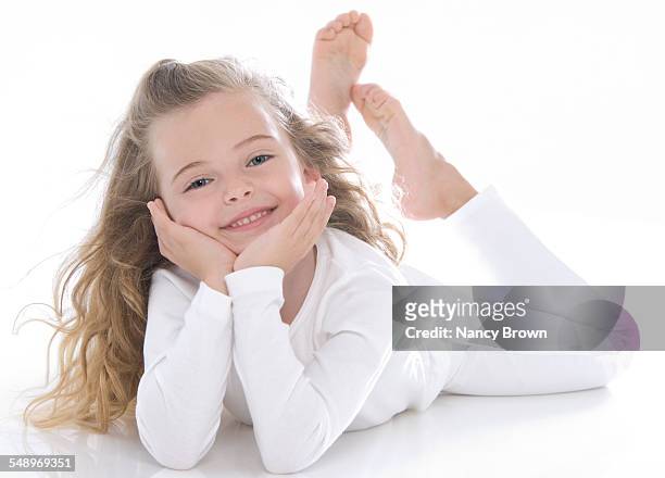 happy six year old girl on white - barefoot girl stock pictures, royalty-free photos & images