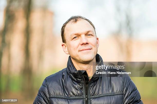 portrait of a man in the park - 禿げ上がる ストックフォトと画像