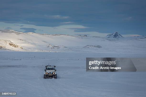 super atv driving off road in the snow. - tundra buggy bildbanksfoton och bilder