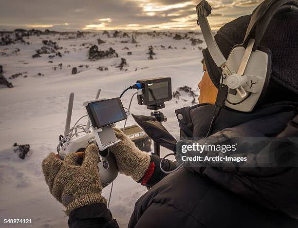 pilot operating a drone with a camera, iceland - drone pilot stock pictures, royalty-free photos & images