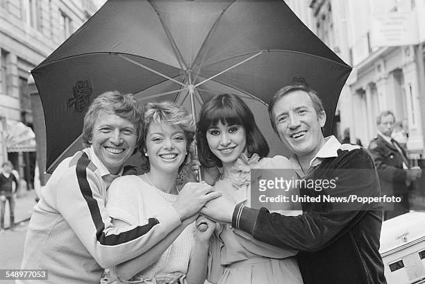 English entertainers, actors and singers, Tommy Steele, Sarah Payne, Danielle Carson and Roy Castle, who all appear in the West End stage production...