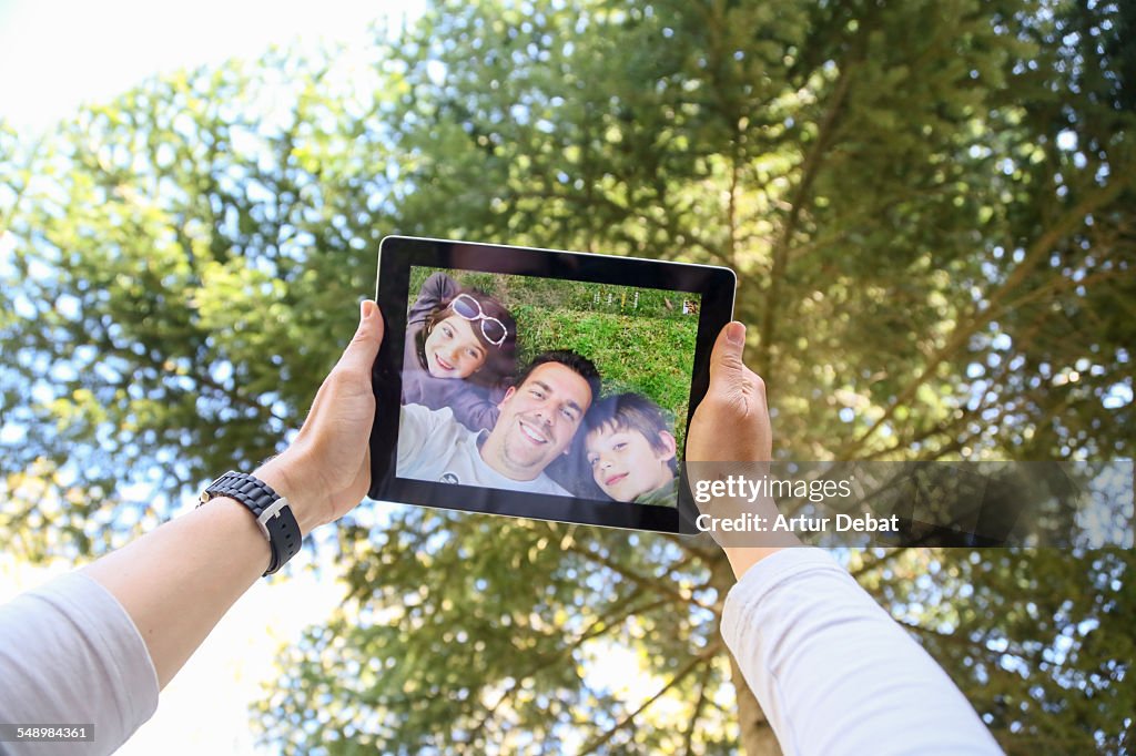 Family taking selfie from personal point of view.