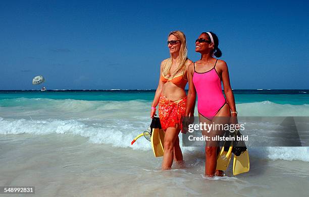 Two female scin diver on the beach, Punta Cana, Caribbean, Dominican Republic