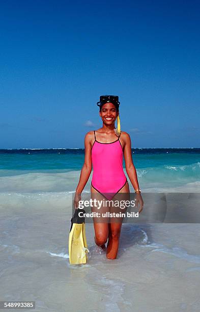 Female scin diver on the beach, Punta Cana, Caribbean, Dominican Republic