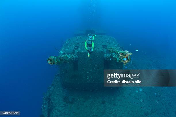 Diver and Twin 8-inch 55 caliber Gun on USS Saratoga, Marshall Islands, Bikini Atoll, Micronesia, Pacific Ocean