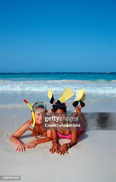 Two female scin diver on the beach, Punta Cana, Caribbean, Dominican Republic