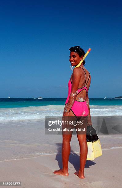 Female scin diver on the beach, Punta Cana, Caribbean, Dominican Republic