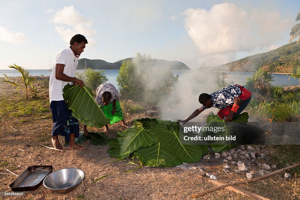 Natives cooking with Lovo Oven, Makogai, Lomaviti, Fiji