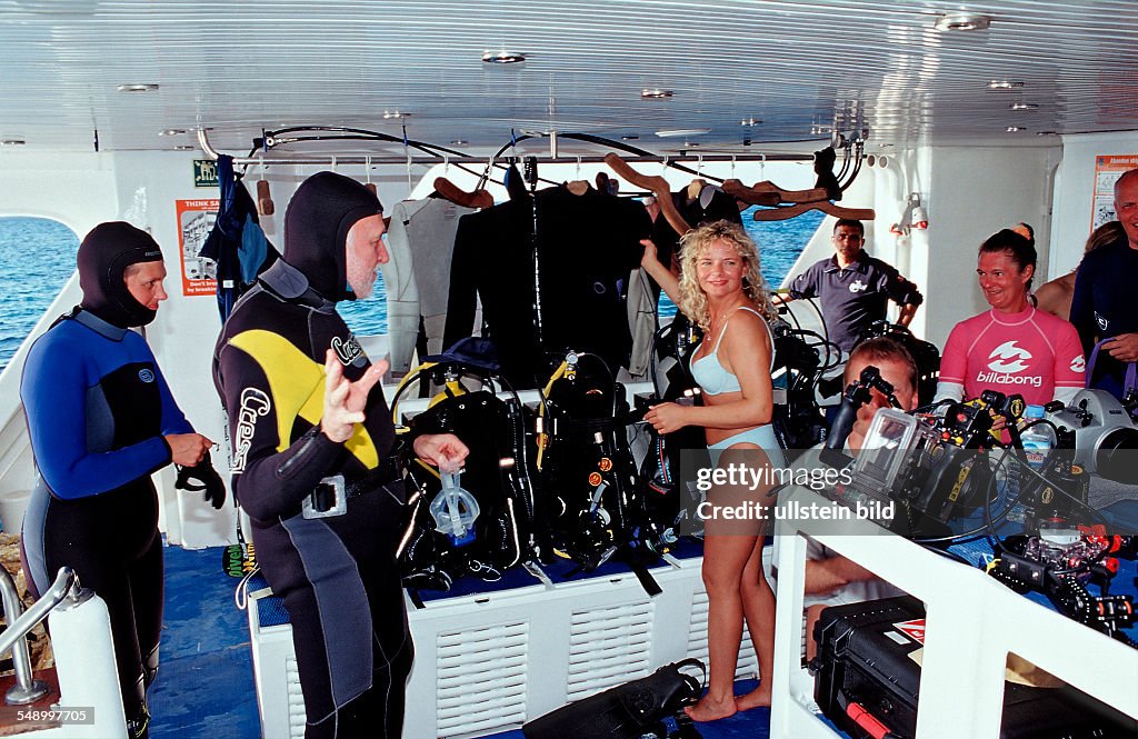 Scuba diver prepares equipment,  Egypt, Red Sea, St. John's Reef, Royal Evolution