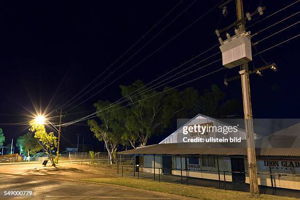 Night photography of the little town in the Western Australian outback. Iron Clad Hotel built in the 1890s, constructed of corrugated iron and listed...