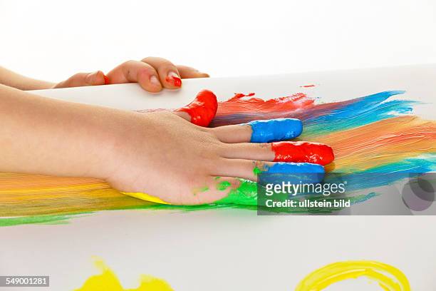 Child uses finger paint