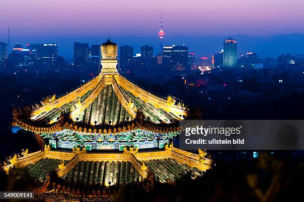 China, Beijing by night - View from the Coal Hill, pavilion, skyline in the background.